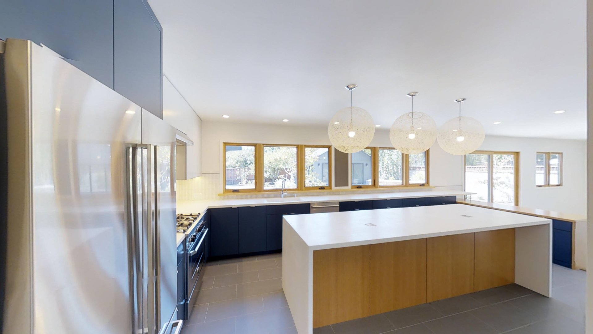 A large white modern kitchen, like one you might find in a property managed by Alliance for Sonoma County Property Management